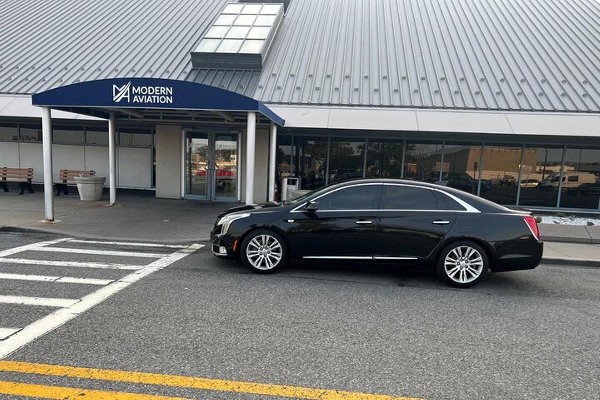 a black car parked in front of a building