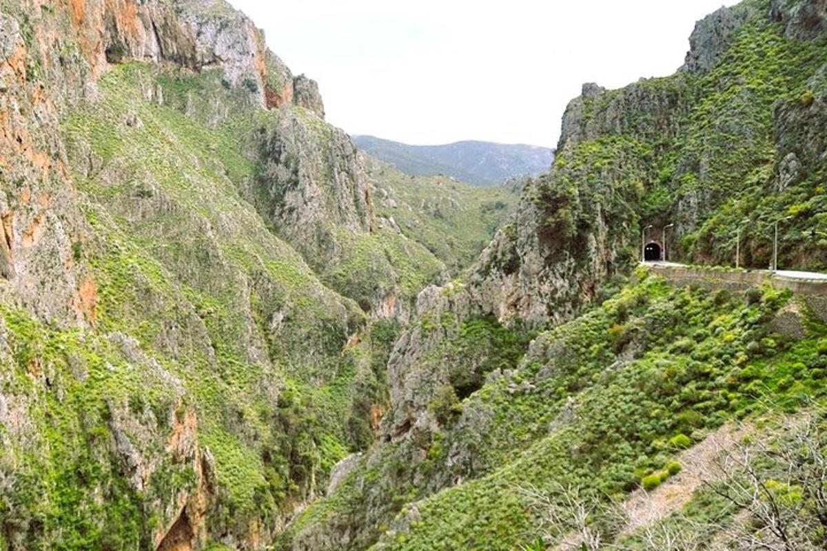 a canyon with a tunnel in the side of a mountain