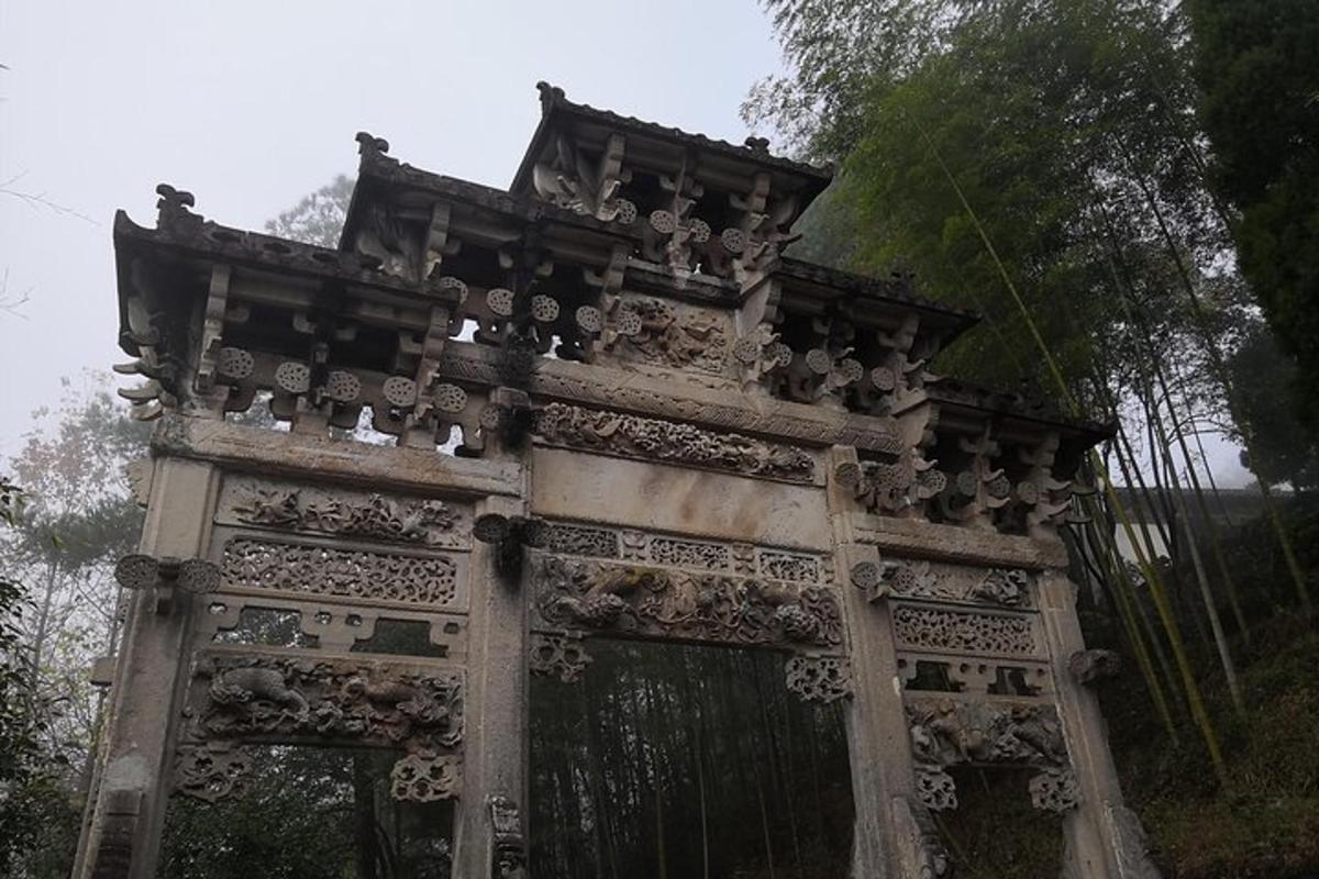 an ornate gate in front of a fence