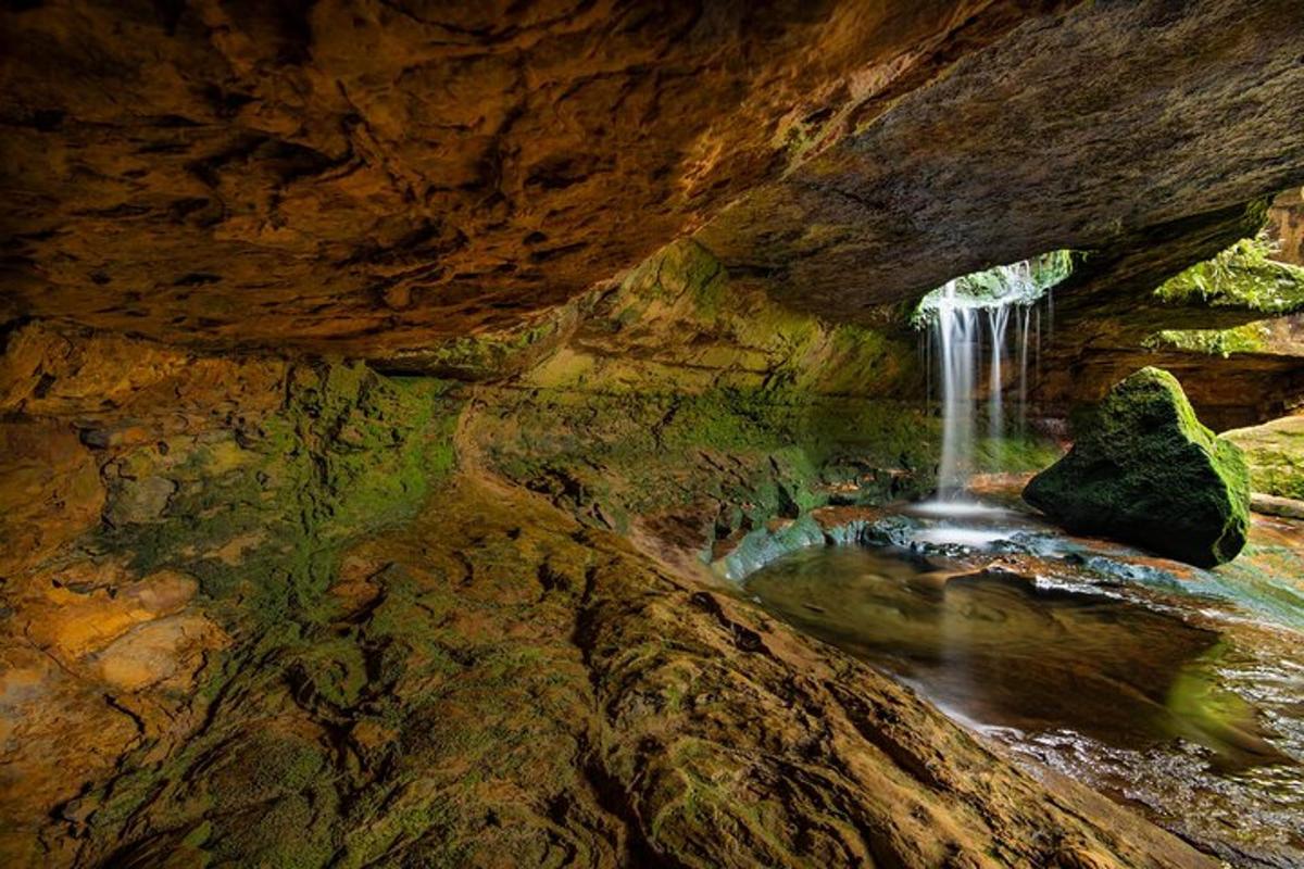 a view of a waterfall in a cave