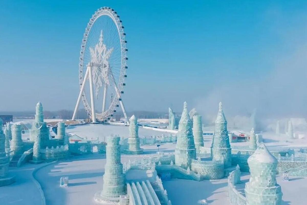 a ferris wheel with ice structures in the snow
