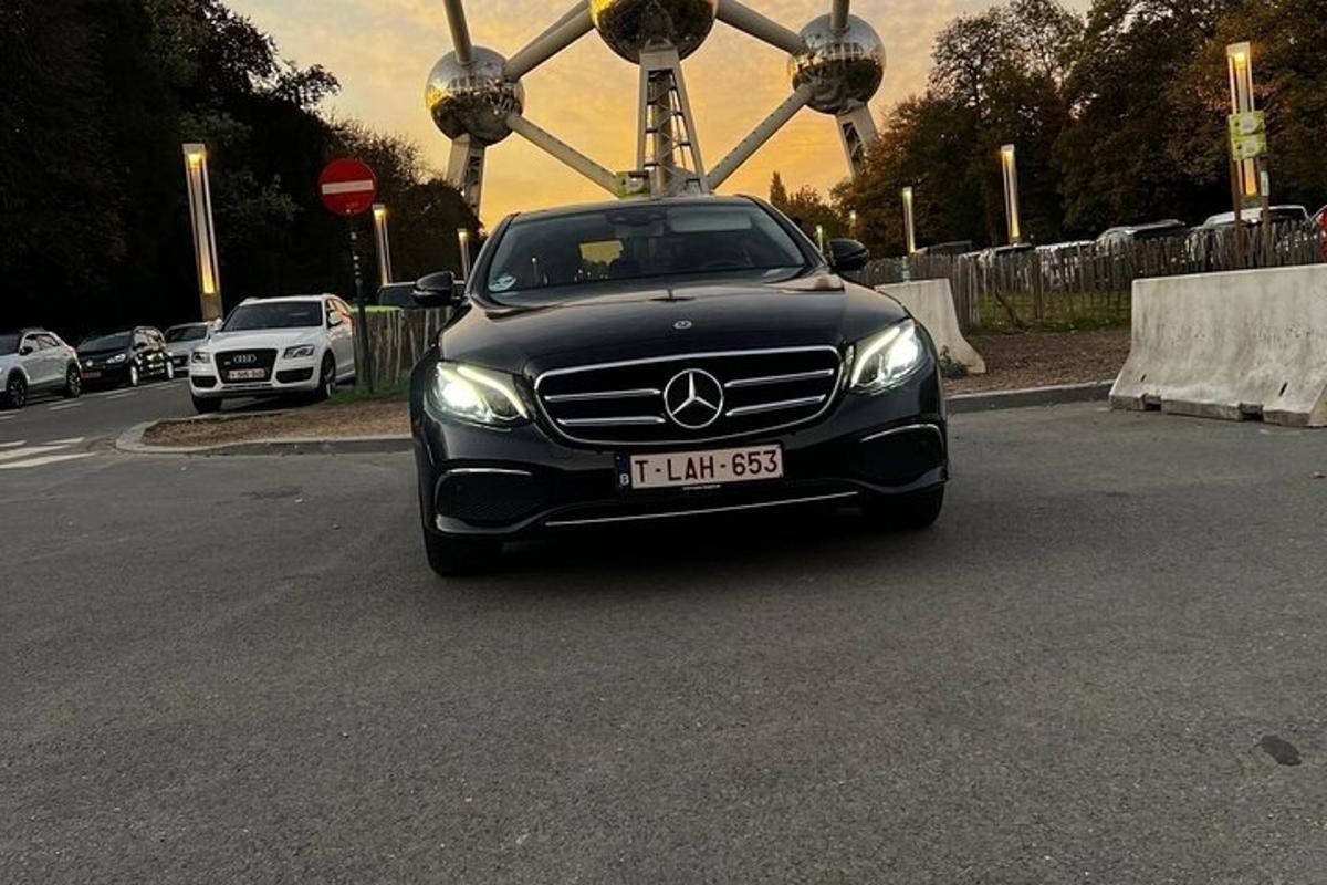a black car is parked in a parking lot