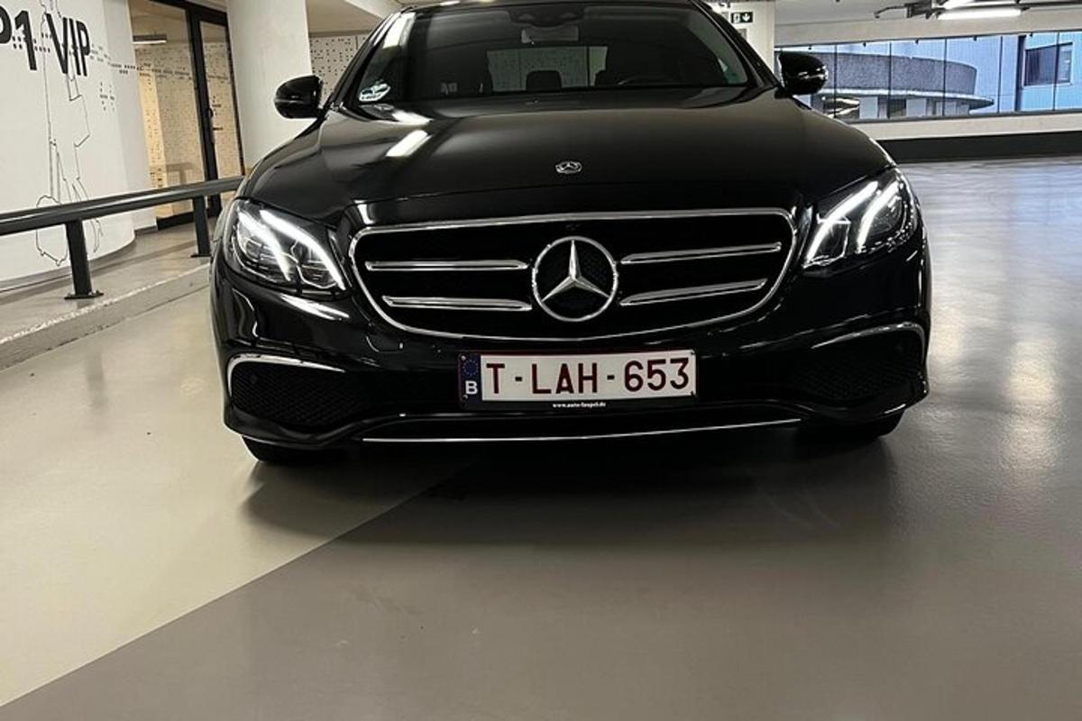a black car parked in a parking lot