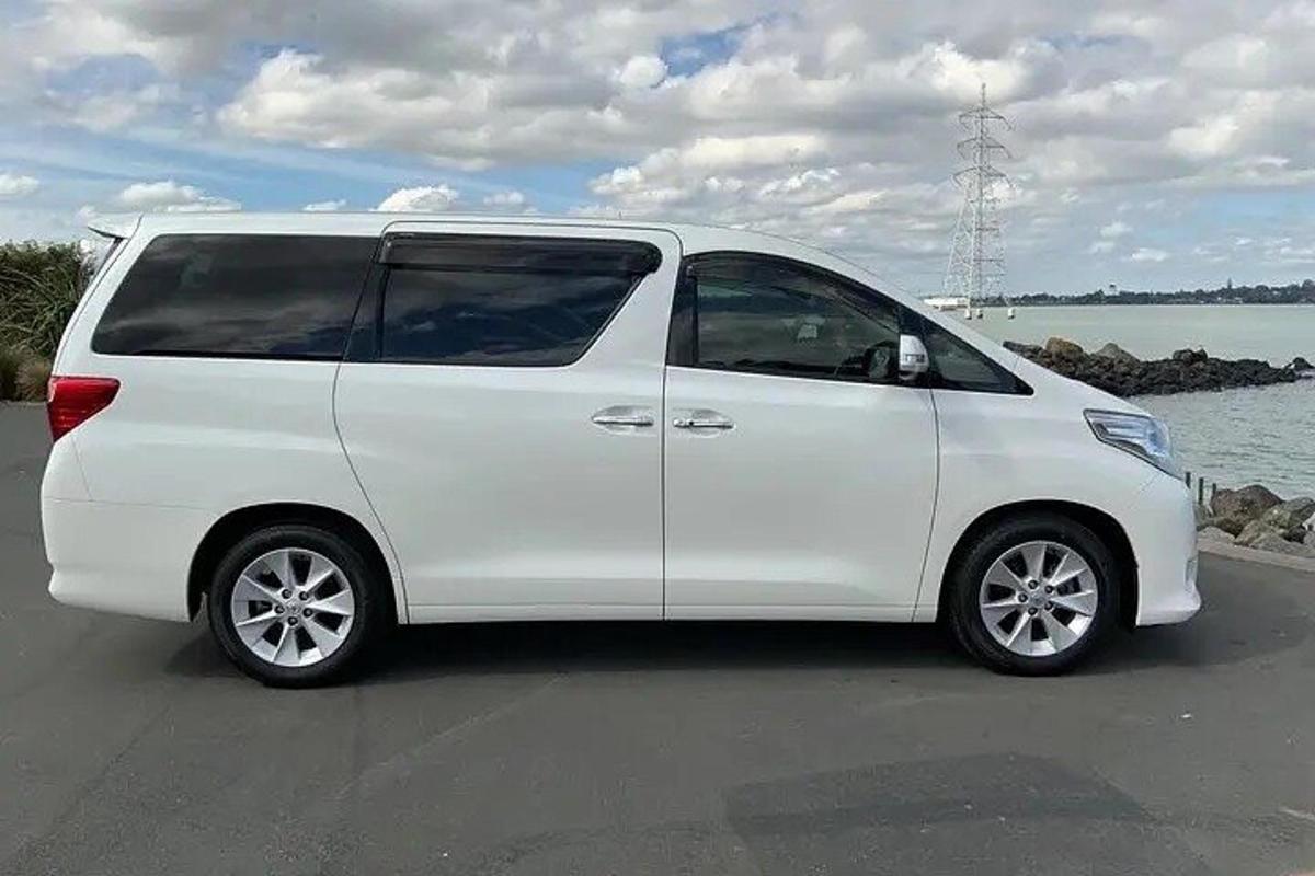 a white van parked next to the water