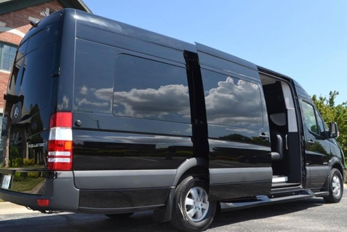 a blue van with clouds in the window