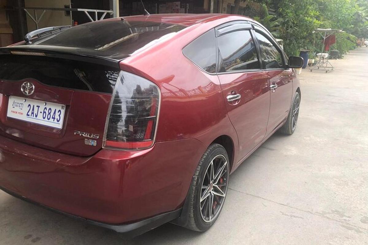 a red car is parked in a garage
