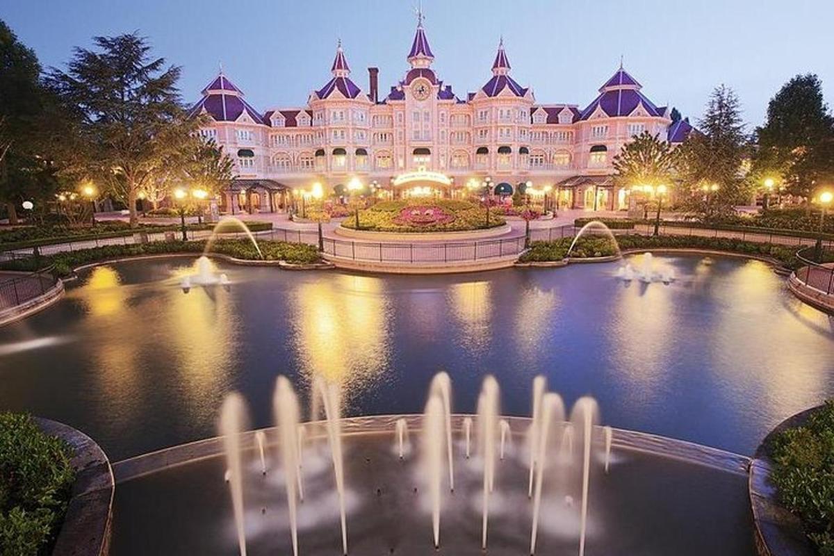 a large building with a fountain in front of it