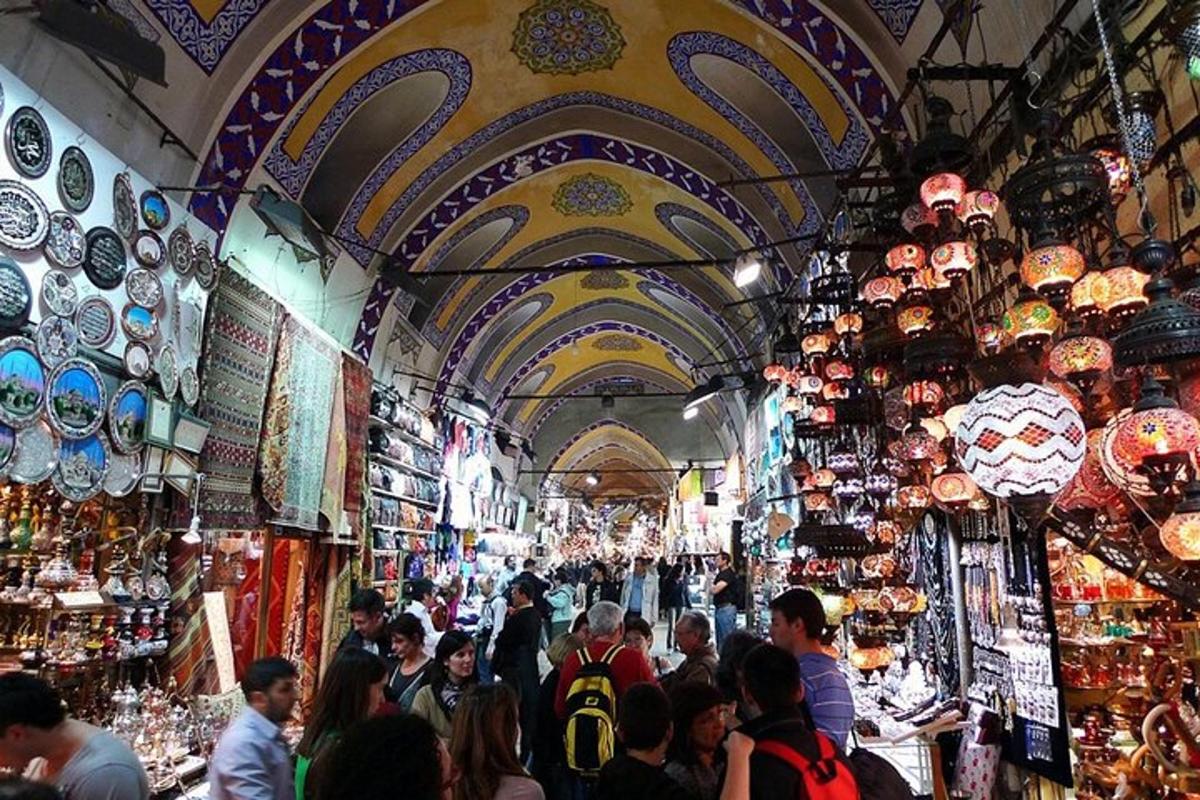 a crowd of people walking through a market in a store