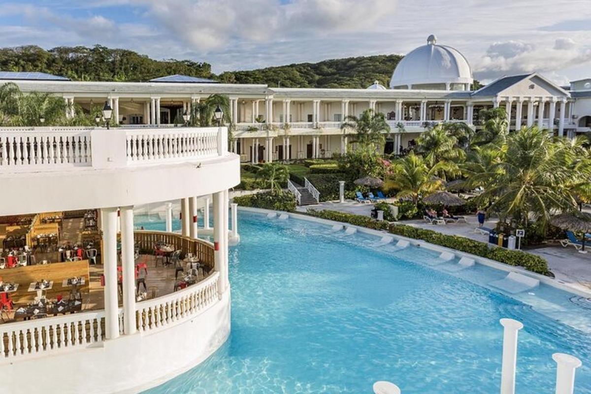 an aerial view of a resort with a swimming pool