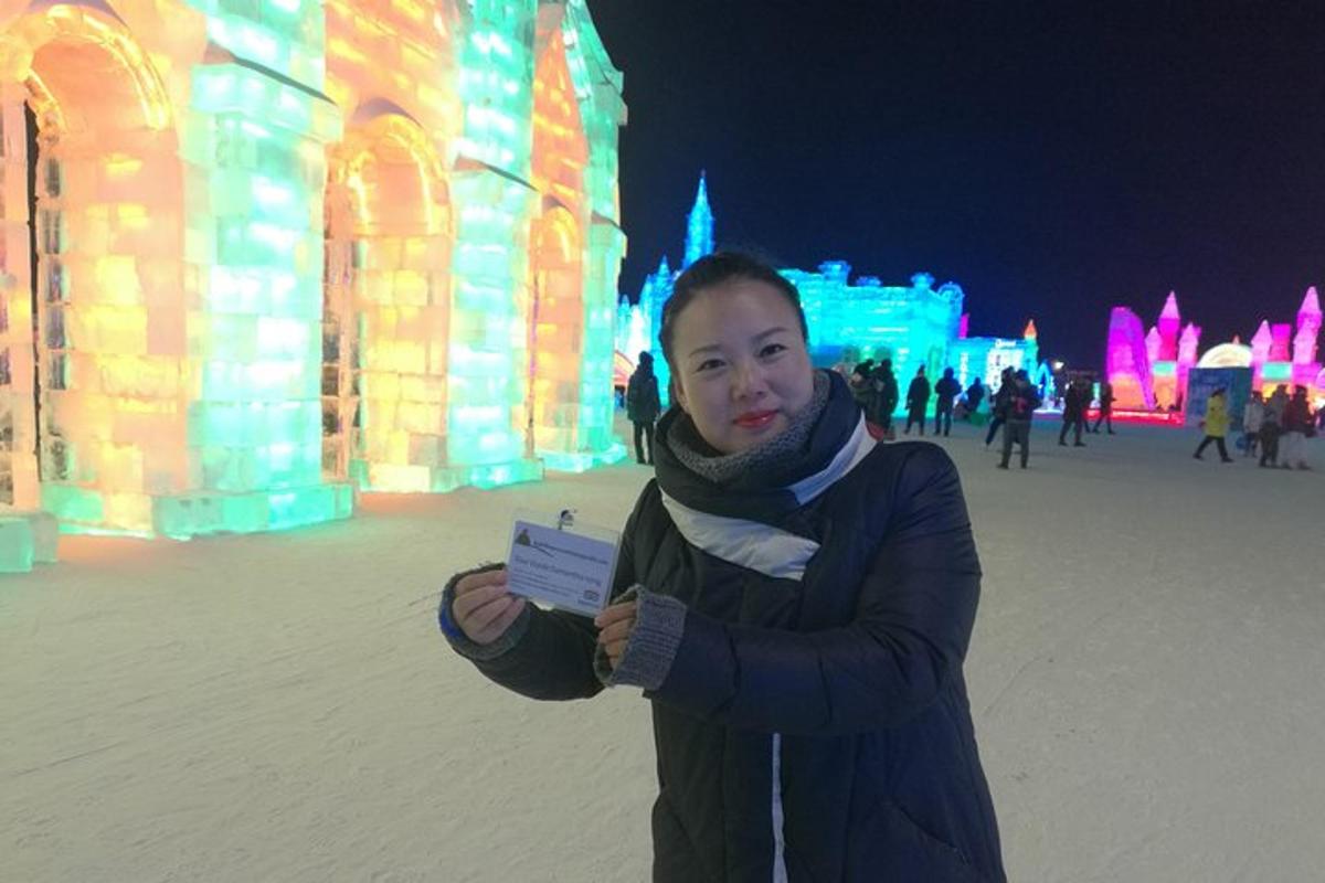 a woman is standing in front of an ice sculpture