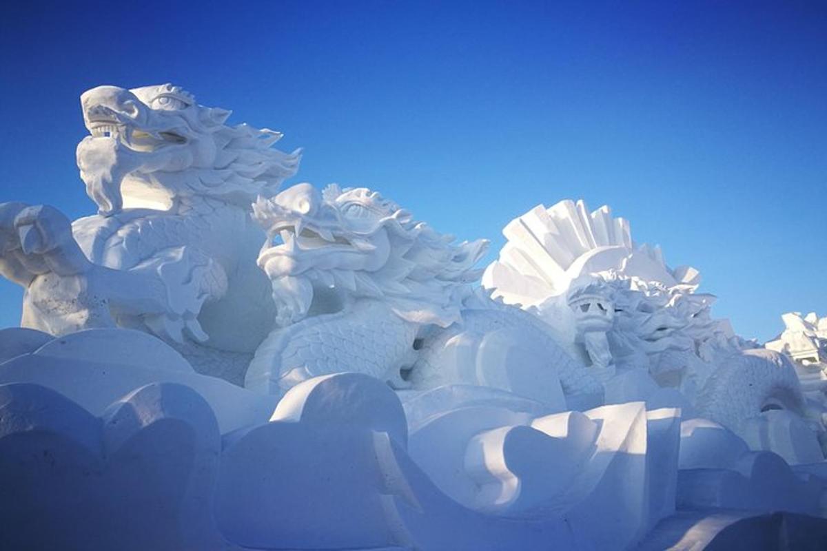 a white statue of animals on top of clouds