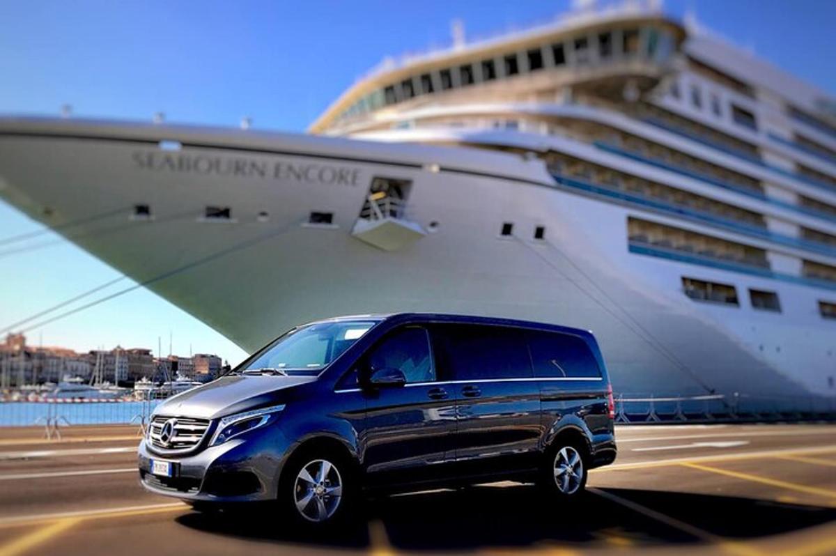 a suv parked in front of a cruise ship