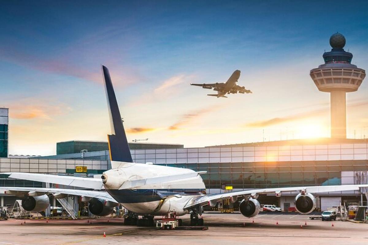 an airplane is parked at an airport with a plane