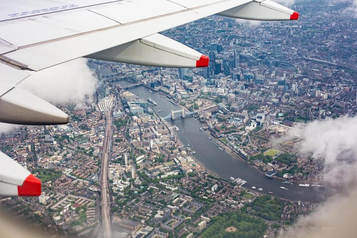 a view from the wing of an airplane flying over a city
