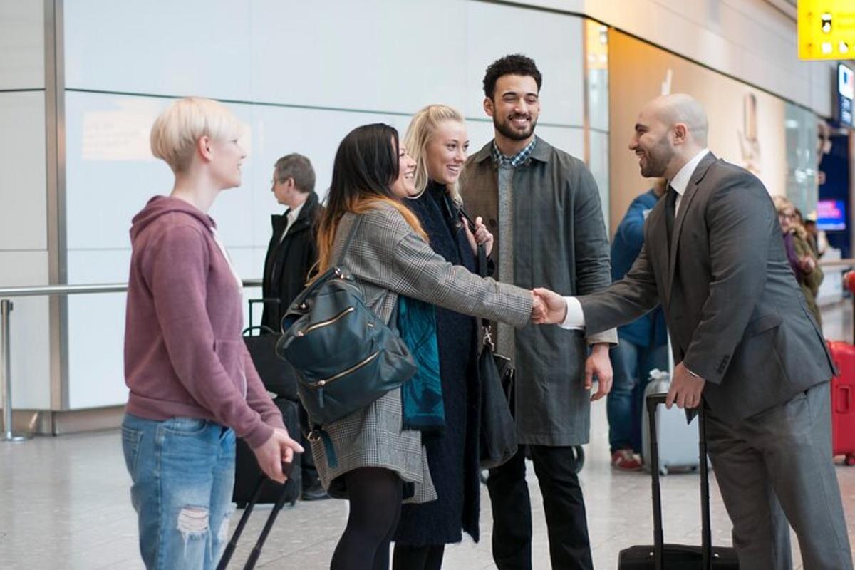a group of people shaking hands in an airport