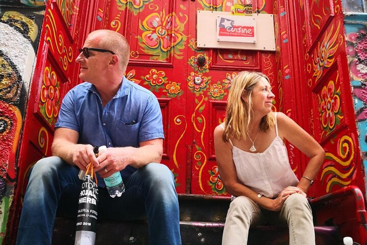 a man and a woman sitting on a bench