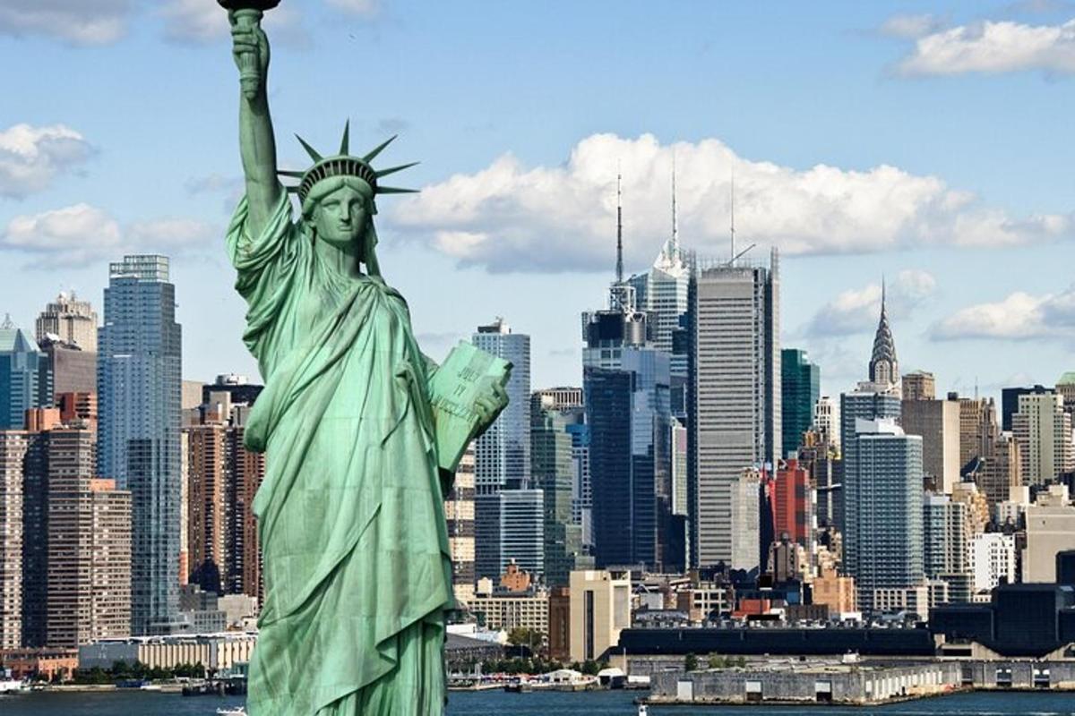 a statue of liberty with a city in the background
