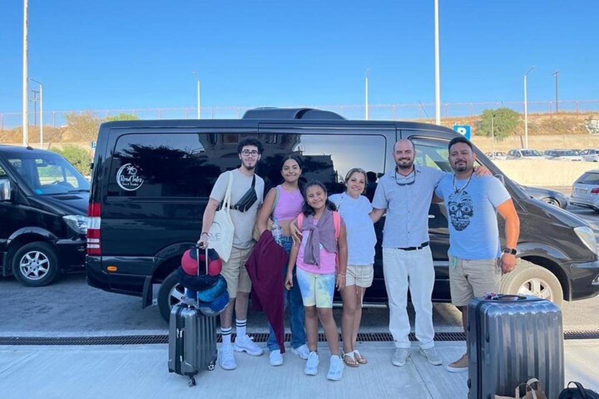 a group of people standing in front of a van