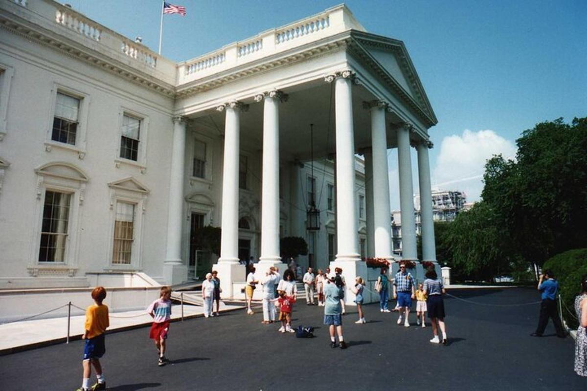 a group of people standing in front of a building