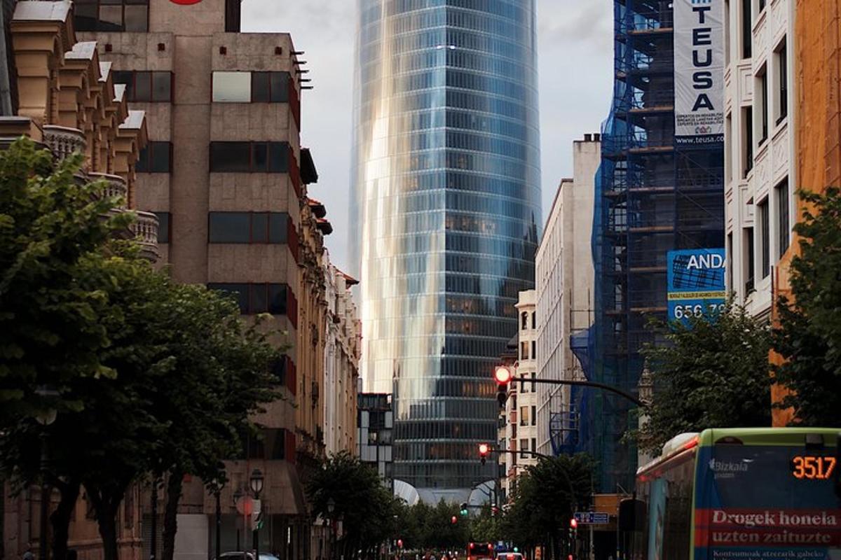 a busy city street with tall buildings and a bus