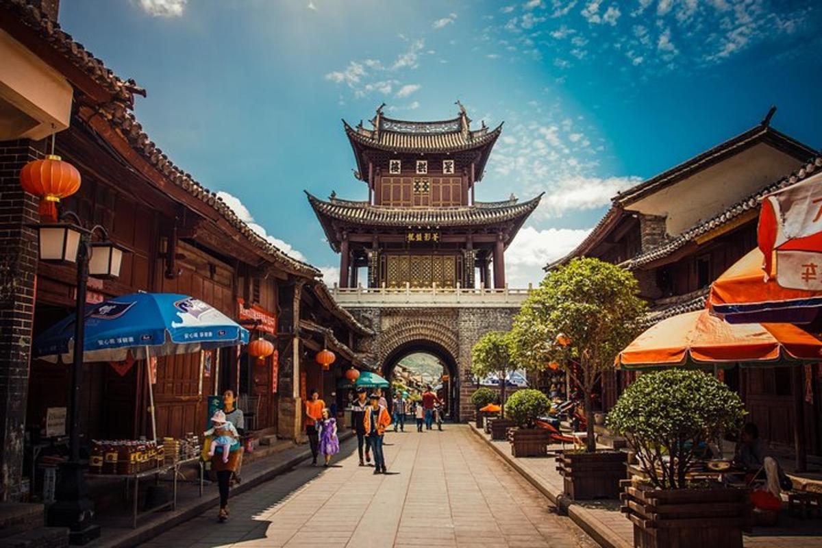 a building with a tower in the middle of a street