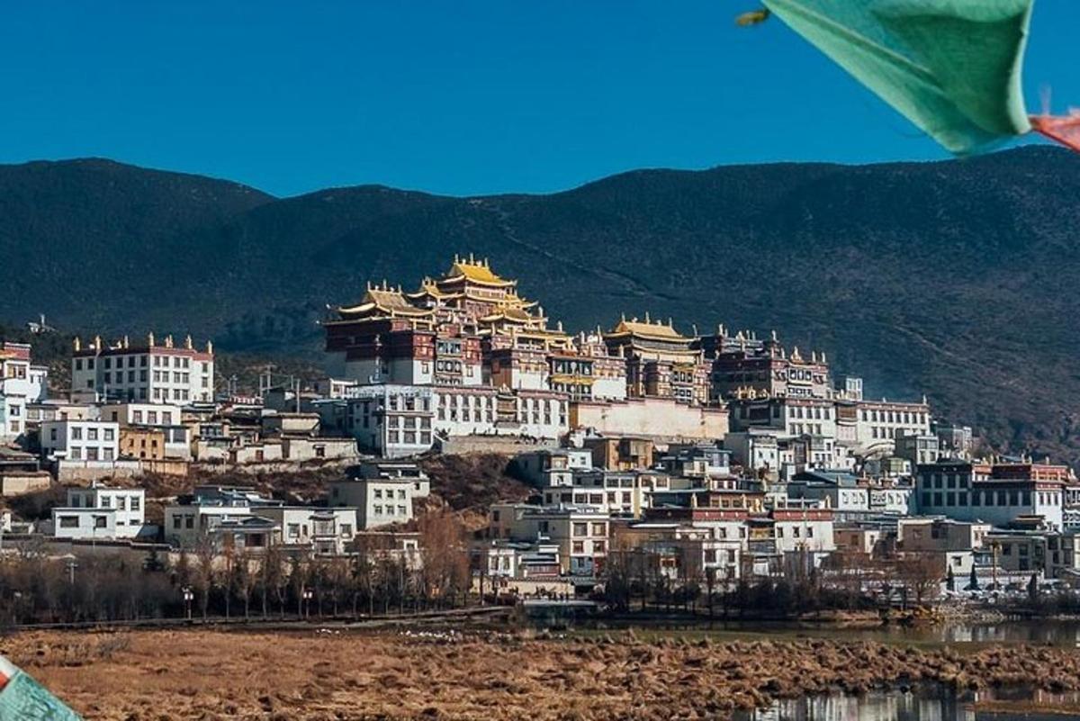 a large group of buildings on top of a mountain