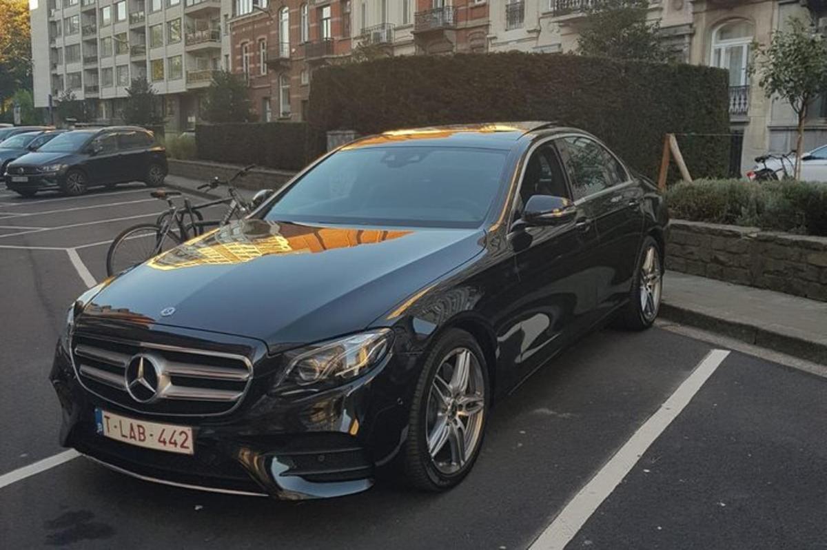 a black car parked in a parking lot