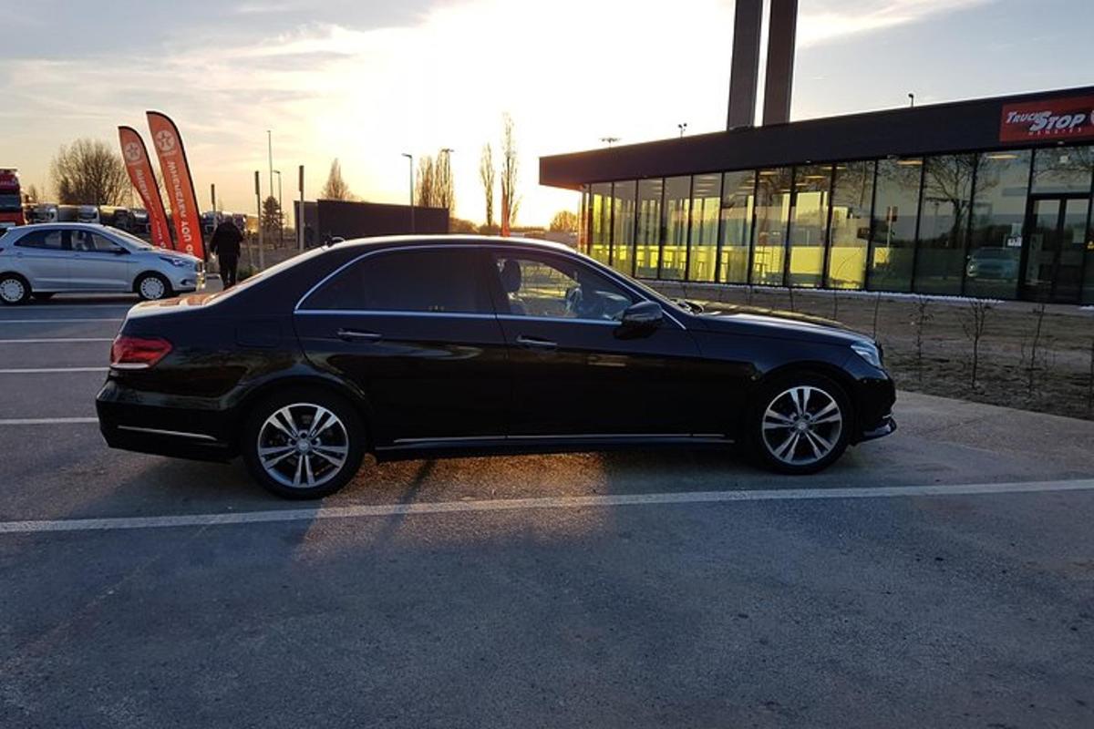 a black car parked in a parking lot