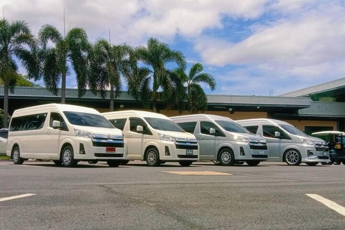 a row of parked cars parked in a parking lot