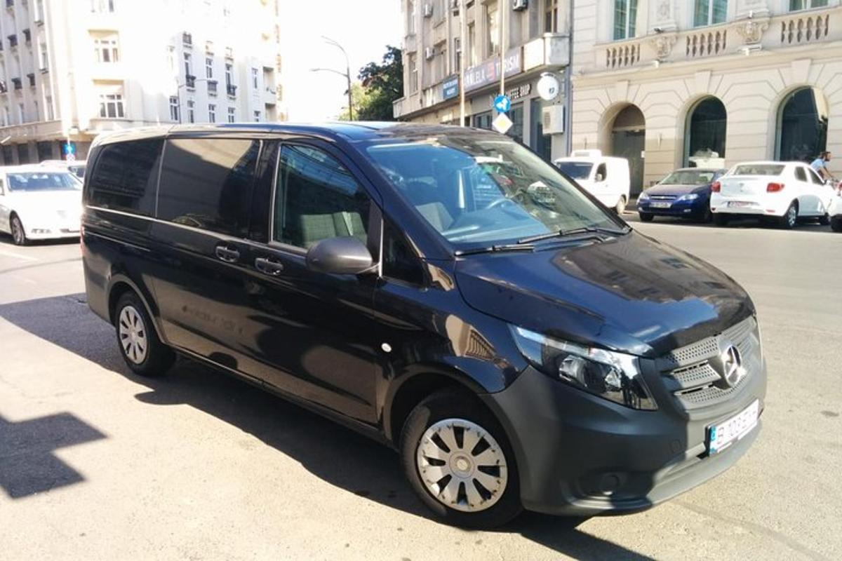 a black van parked on the side of a street