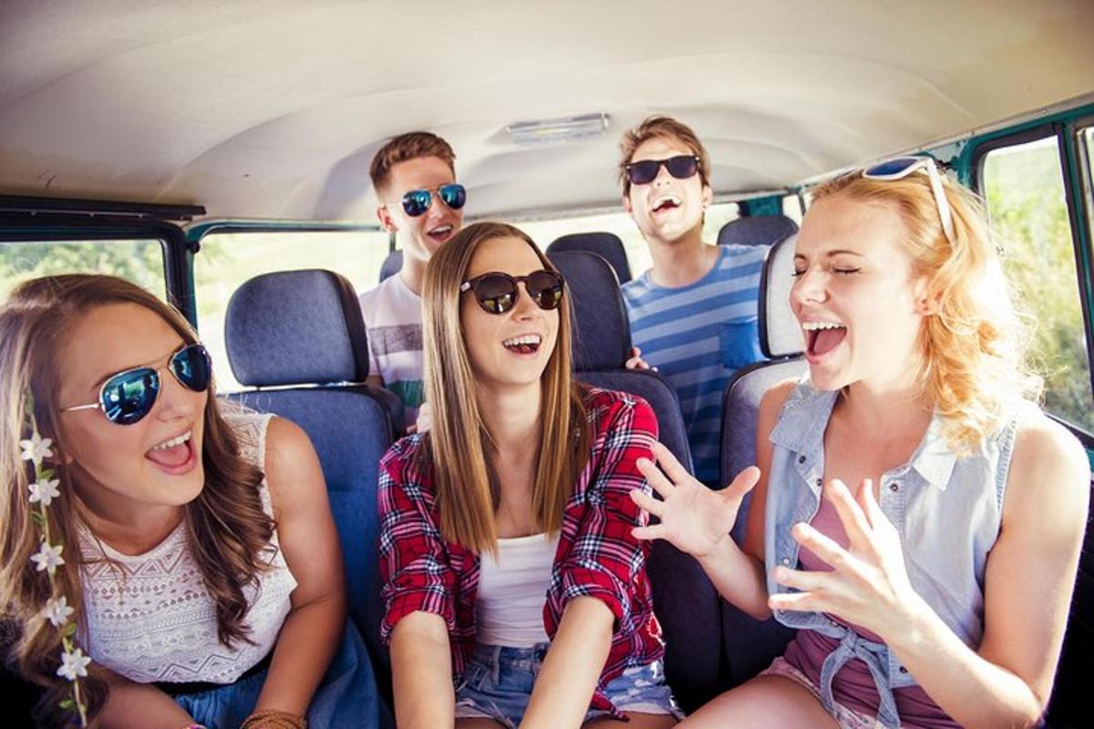 a group of people sitting in the back of a van