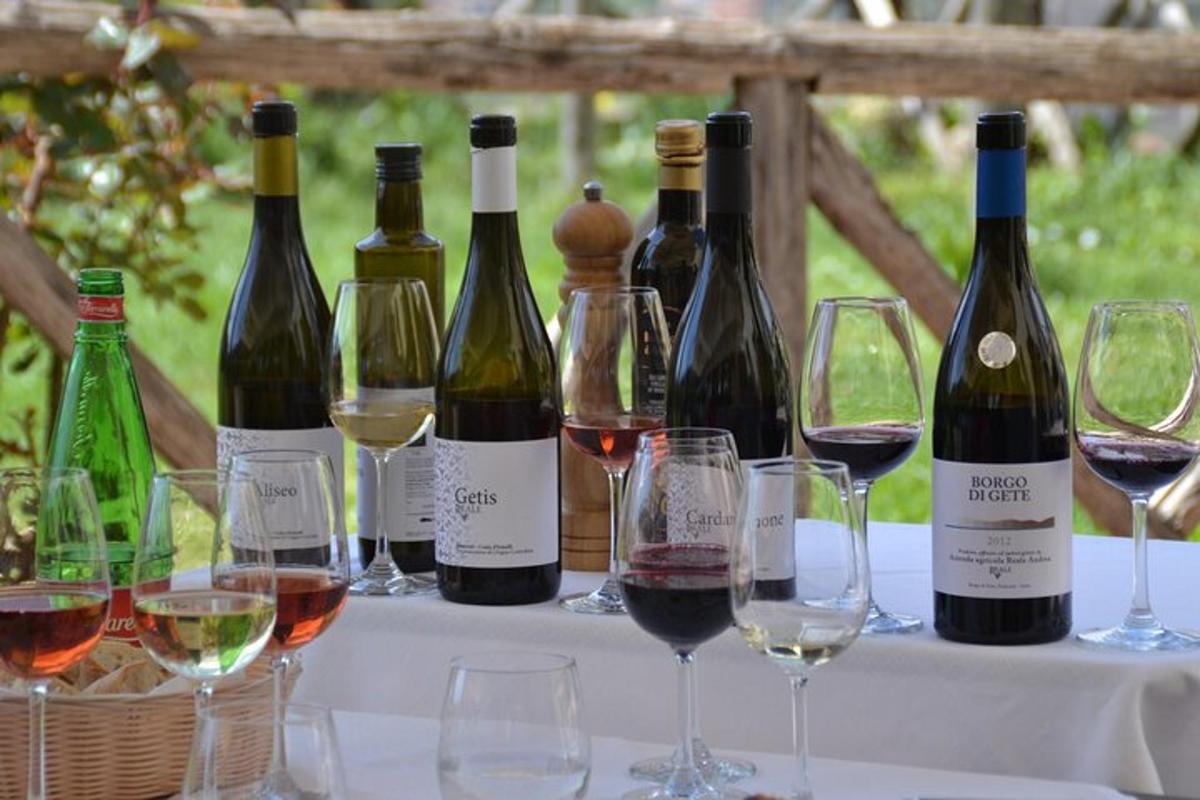 a group of wine bottles and glasses on a table