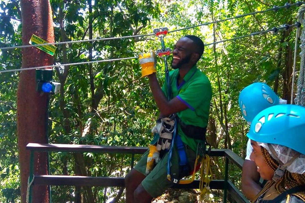 a man on a zip line in the jungle