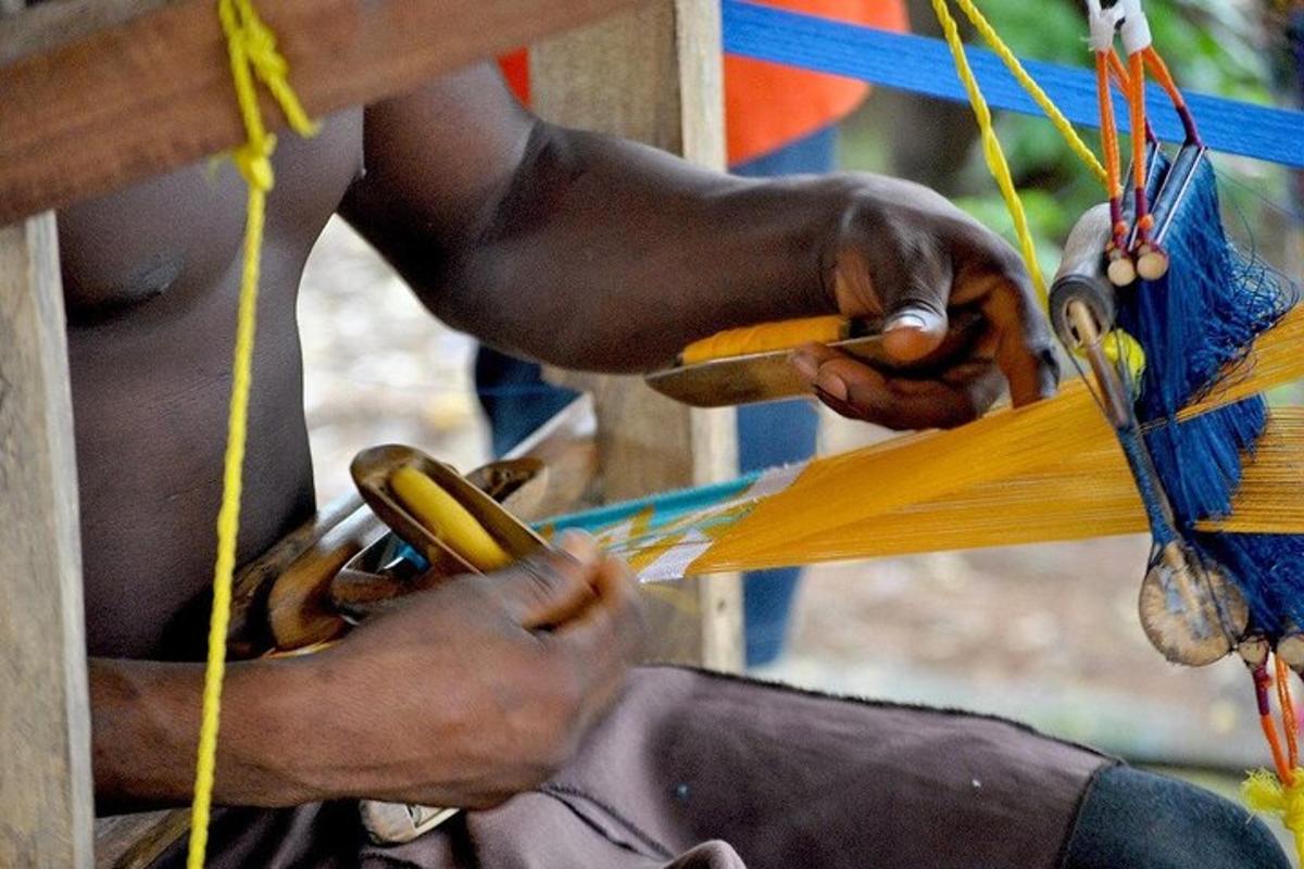 a person is tying up a piece of paper