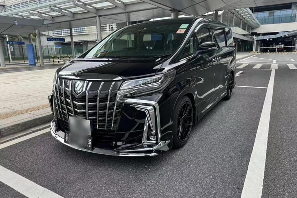 a black car parked in a parking lot