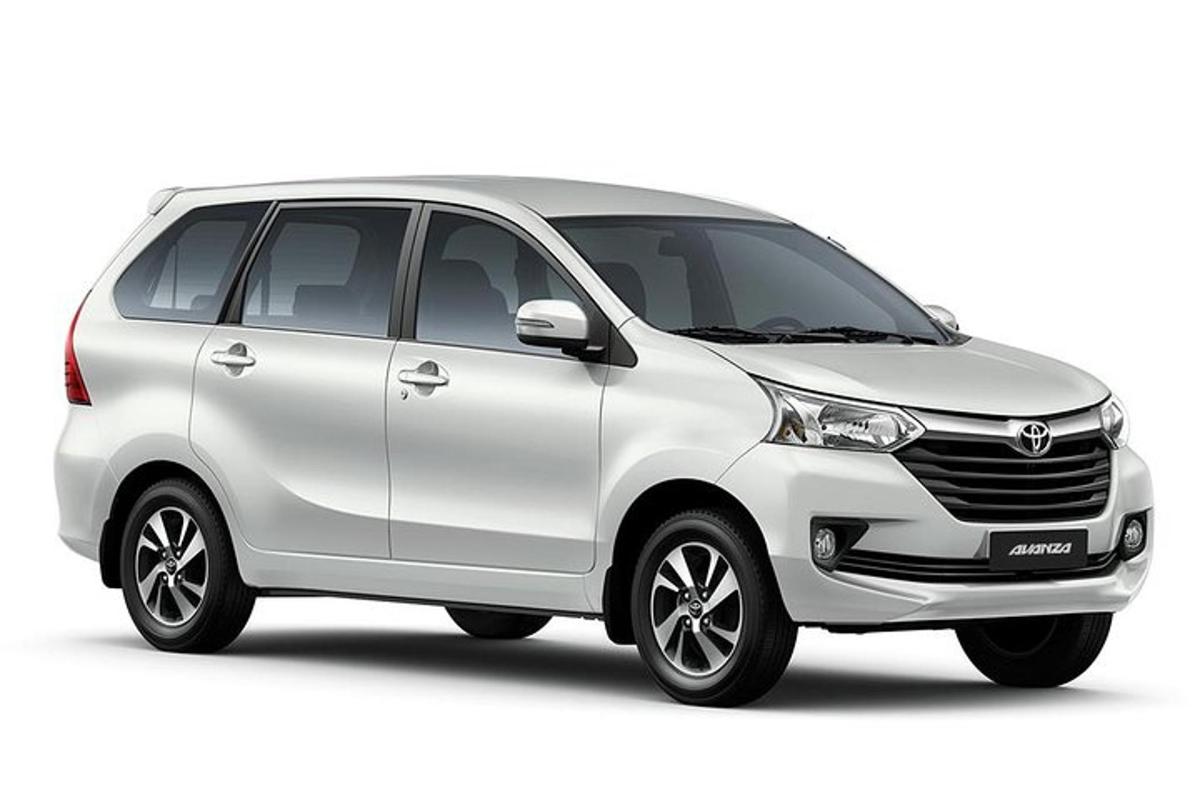 a white toyota parked on a white background
