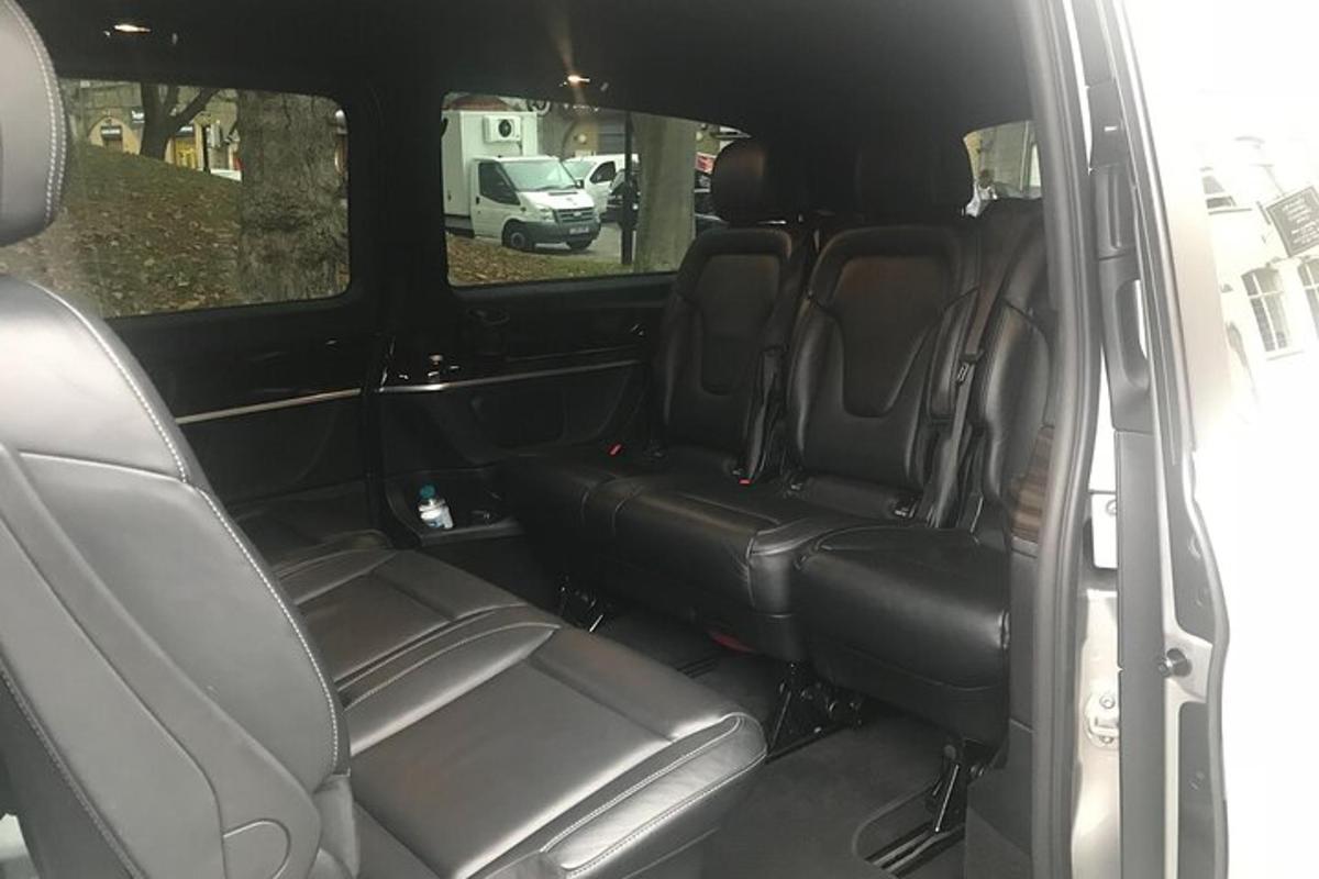 an open back seat of a car with empty seats