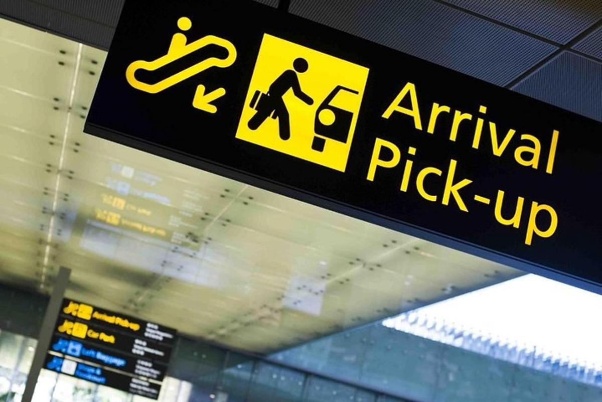 a sign for an airport pick up sign
