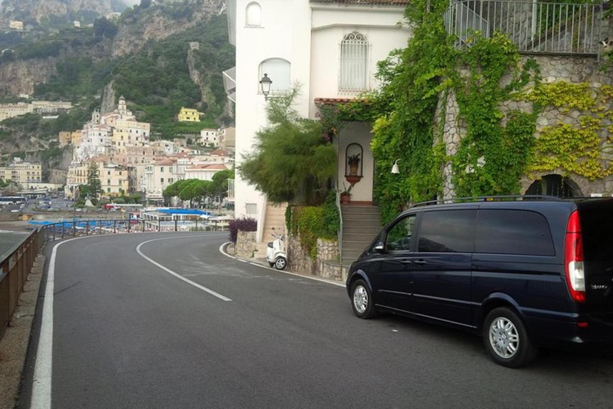 a black van parked on the side of a road