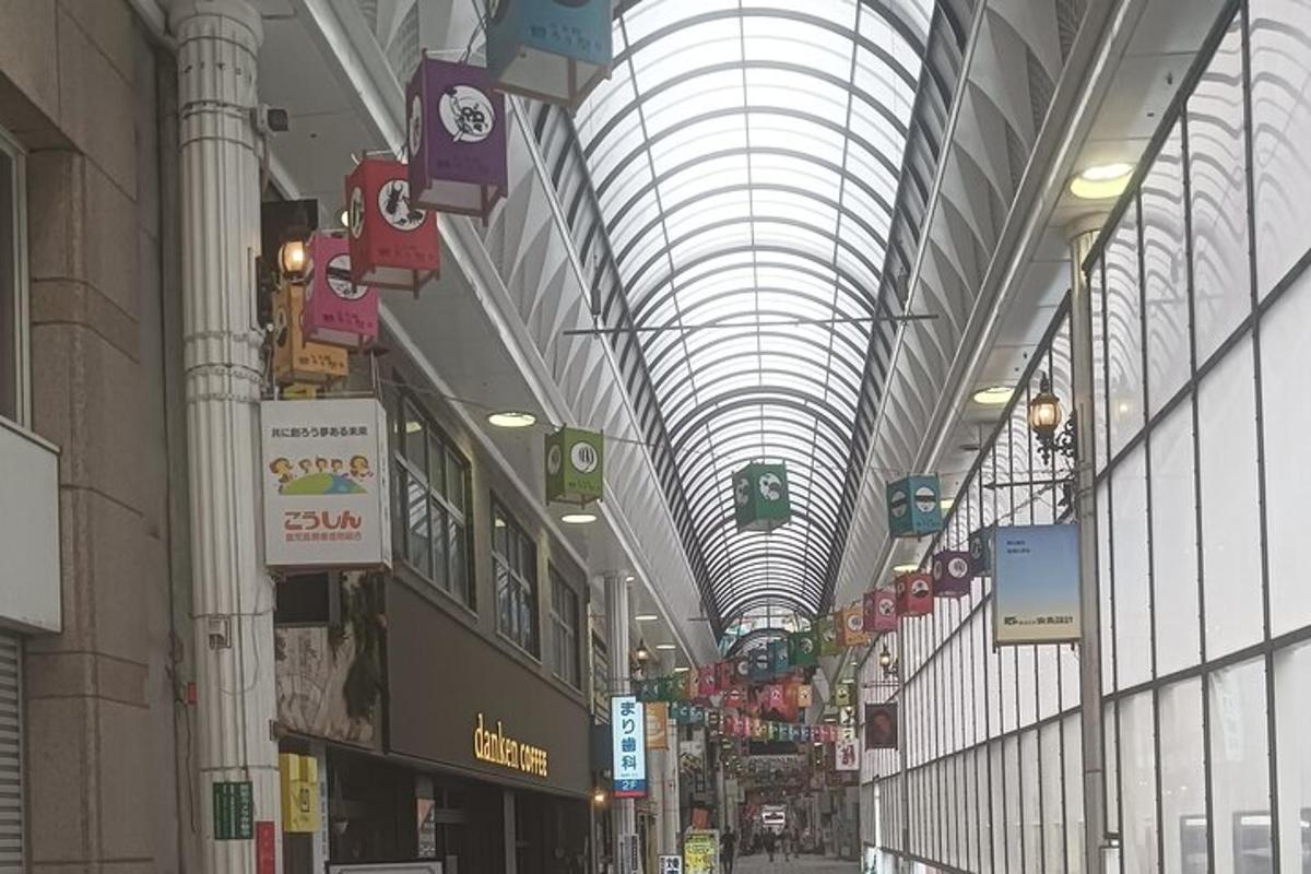 a shopping mall with a domed ceiling with signs
