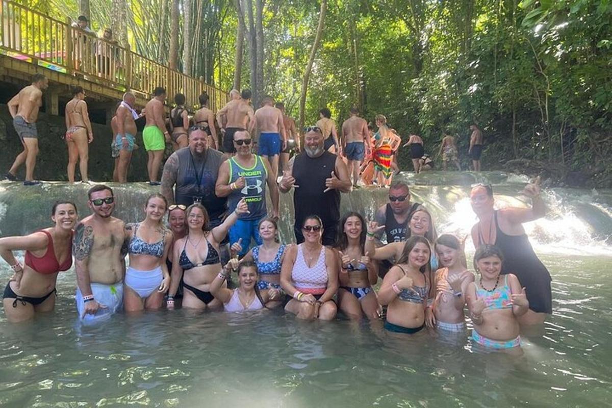 a group of people posing for a picture in the water