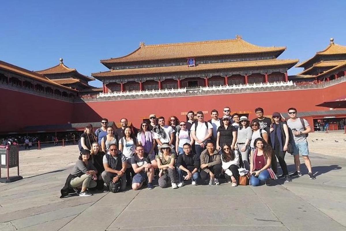 a group of people posing in front of a building