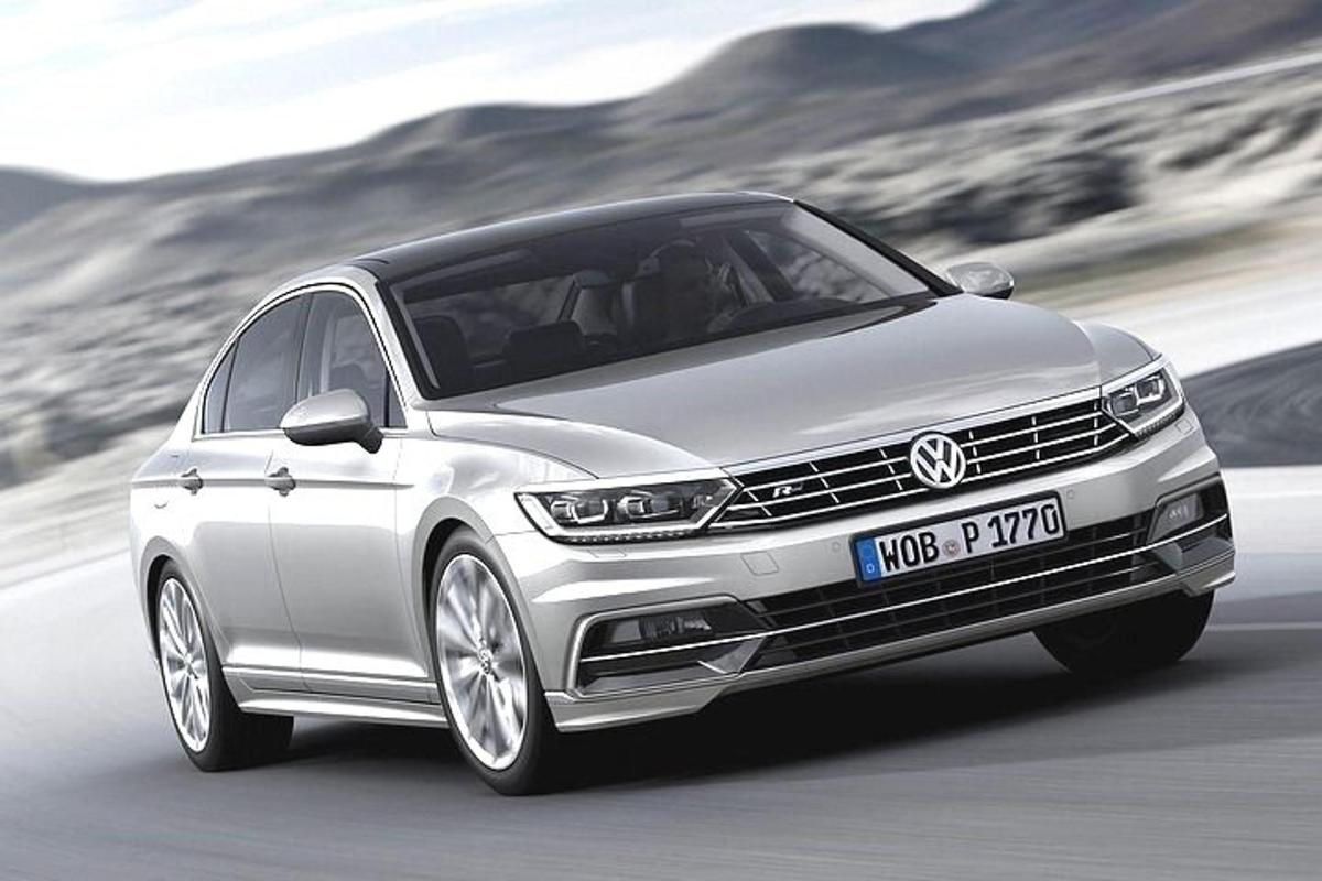 a silver car is driving down a road