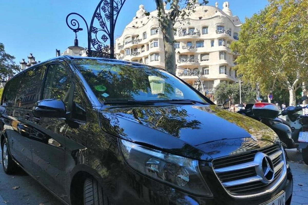 a black car parked in front of a building