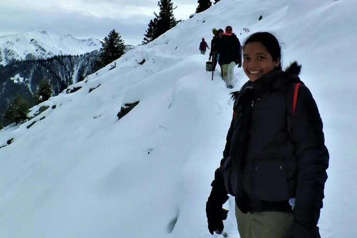 a man standing on a snow covered mountain