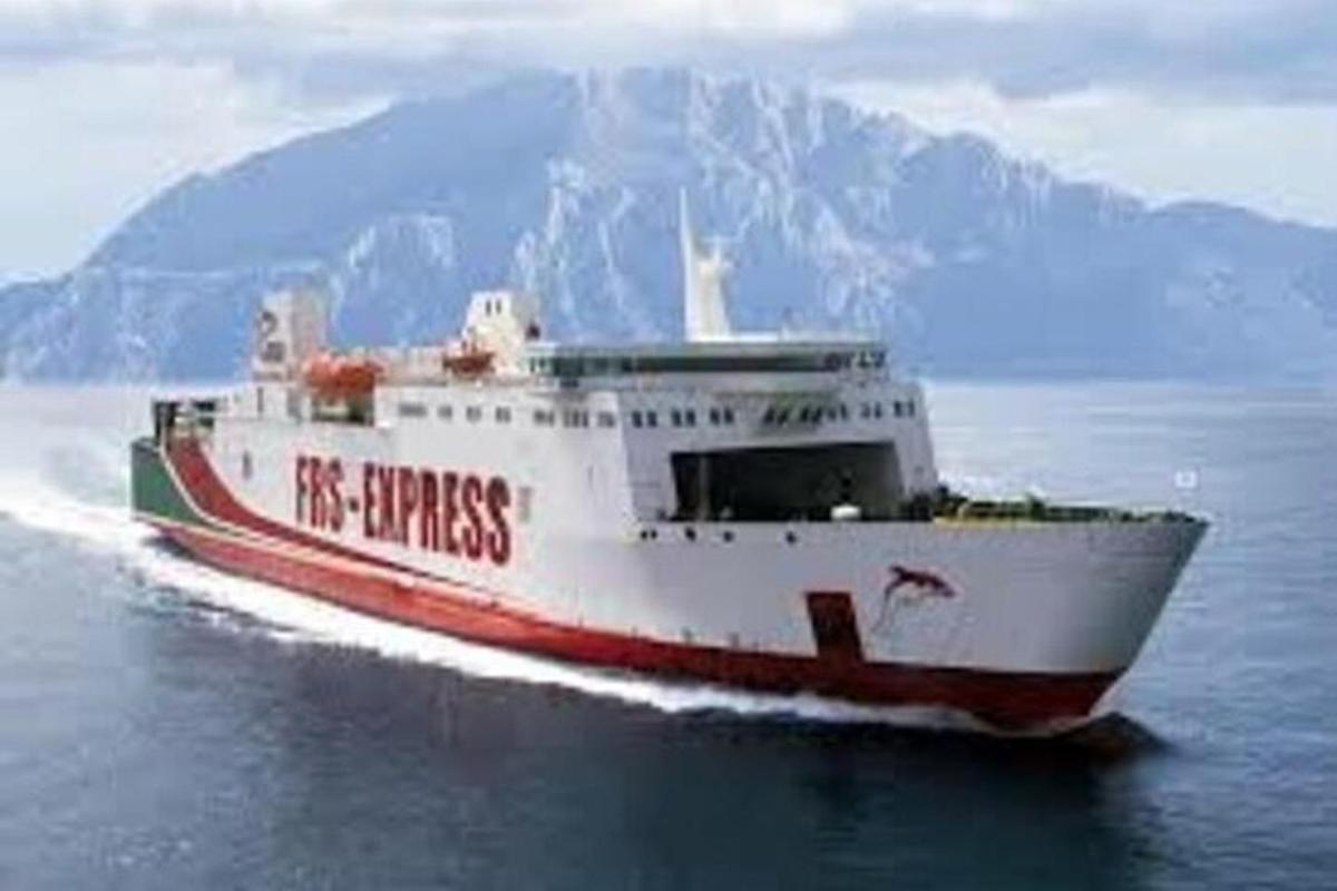 a red and white boat in the water