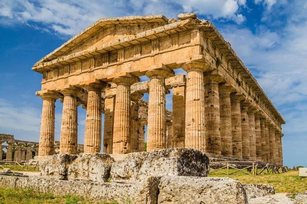 an ancient temple with columns in front of a building
