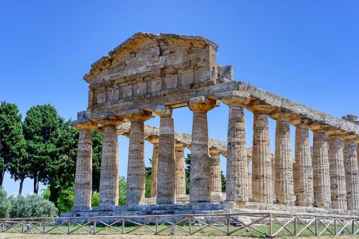 an ancient temple with columns in front