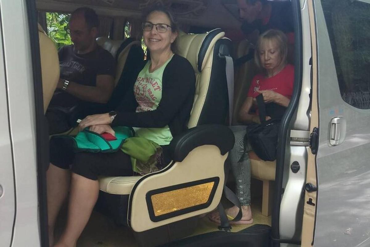 a woman sitting in the back of a van