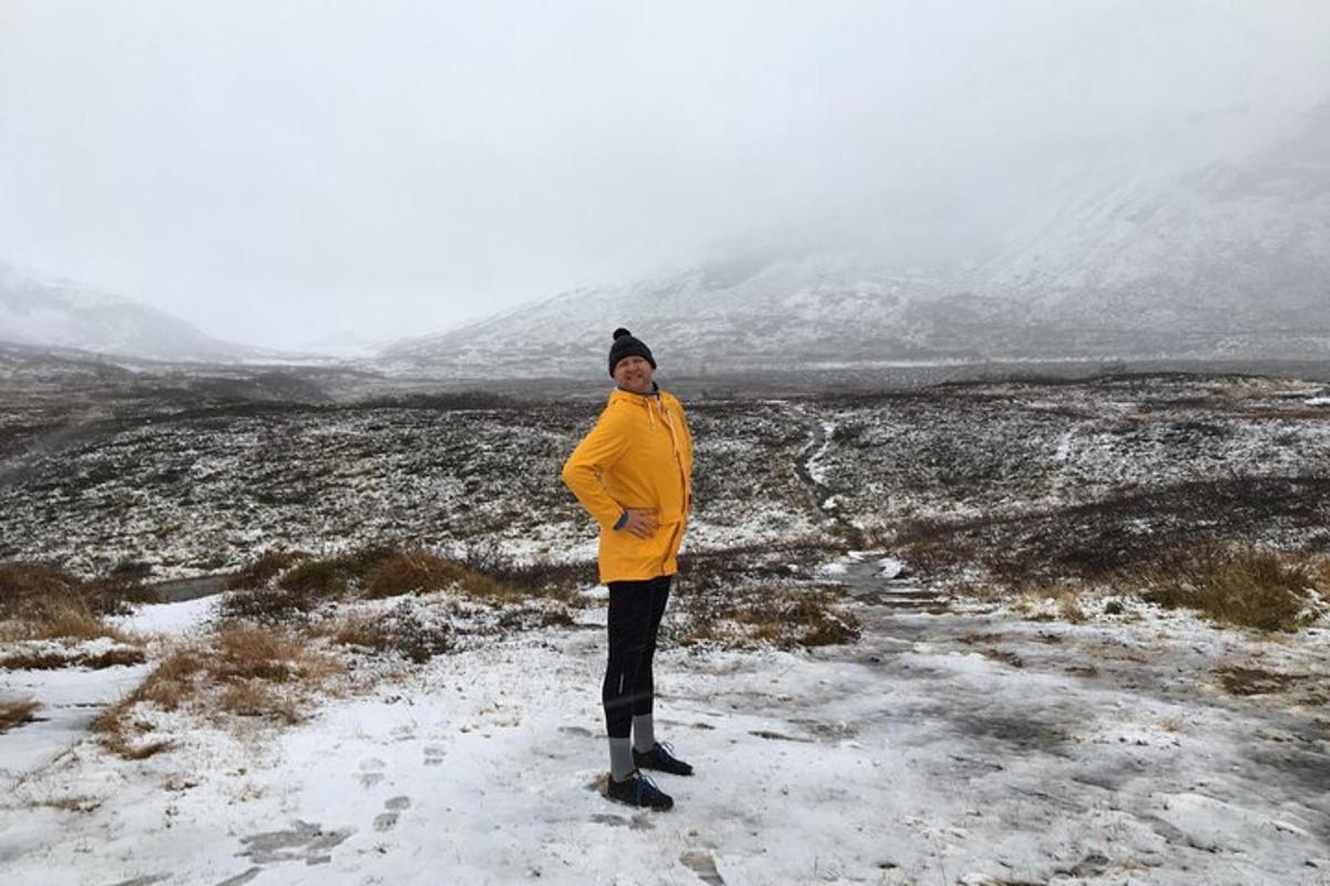 a person standing in a snow covered field